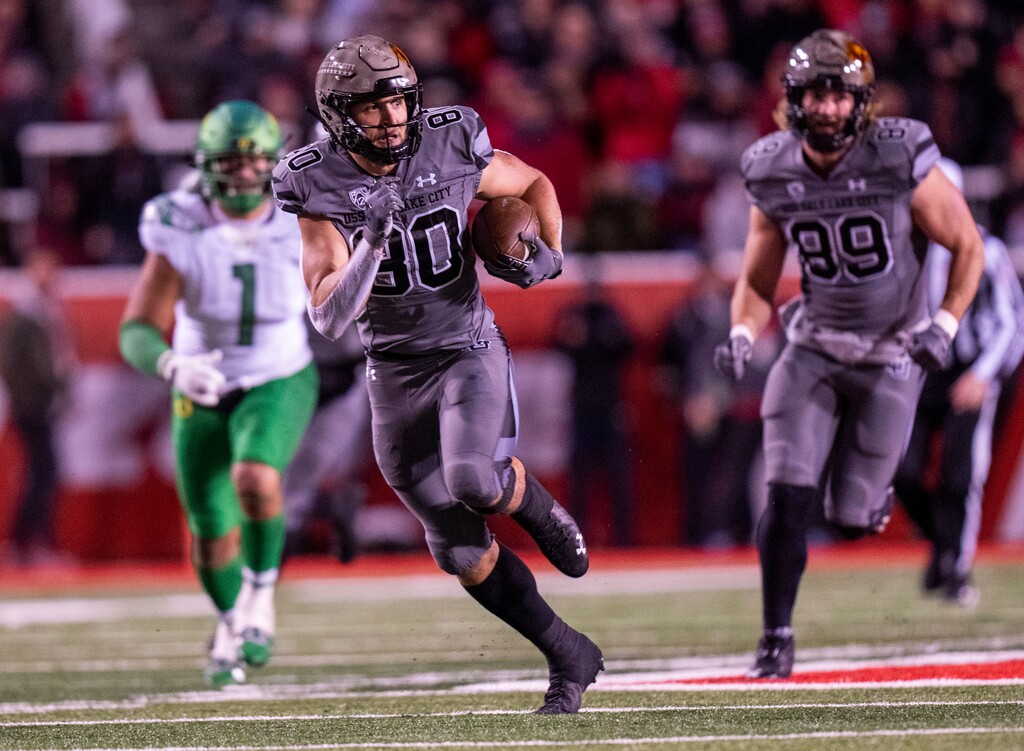 (Rick Egan | The Salt Lake Tribune)  Utah Utes tight end Brant Kuithe (80) runs for extra yards after catching a pass, in PAC-12 action between the Utah Utes and the Oregon Ducks. At Rice-Eccles Stadium in Salt Lake City, on Saturday, Nov. 20, 2021.