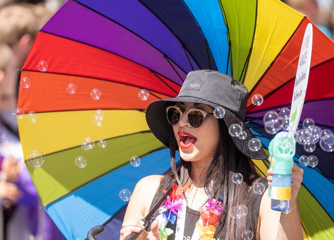 (Rick Egan | The Salt Lake Tribune)  Mira Acheson makes bubbles in the Pride Parade, on Sunday, June 4, 2023.