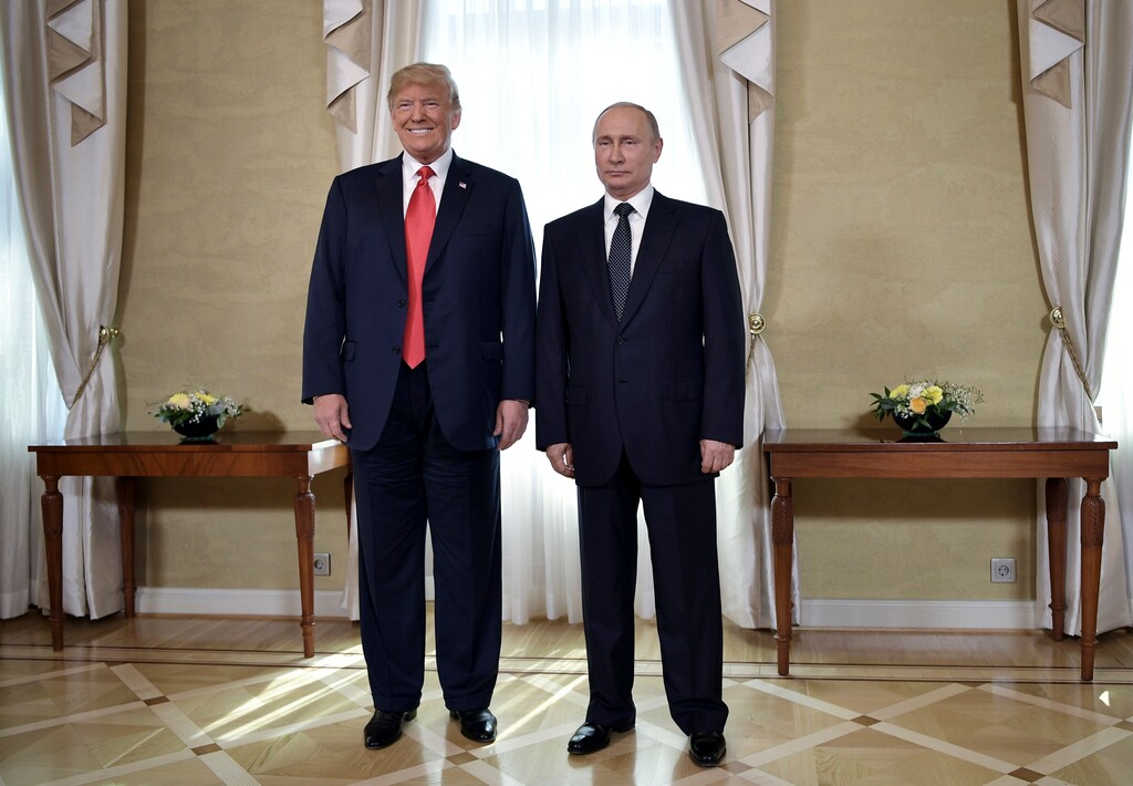 (Alexei Nikolsky | Sputnik | Kremlin Pool Photo | The Associated Press) U.S. President Donald Trump and Russian President Vladimir Putin, right, pose for a photograph at the Presidential Palace in Helsinki, Finland, Monday, July 16, 2018 prior to Trump's and Putin's one-on-one meeting in the Finnish capital.