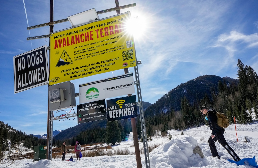 (Francisco Kjolseth | The Salt Lake Tribune) A sign warns of avalanche terrain and provides a sound test for checking backcountry beacons at Cardiff Fork in Big Cottonwood Canyon on Monday, Feb. 23, 2026. More than 70 avalanches were reported in the last week across the Wasatch backcountry, with first responders racing from one rescue to the next.