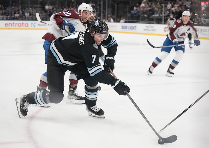 (Bethany Baker | The Salt Lake Tribune) Utah Hockey Club defenseman Michael Kesselring (7) fights for the puck during the game between the Utah Hockey Club and the Colorado Avalanche at the Delta Center in Salt Lake City on Thursday, Oct. 24, 2024.