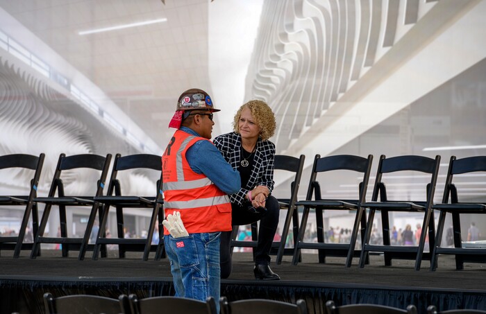 (Leah Hogsten  |  The Salt Lake Tribune)  Salt Lake City mayor Jackie Biskupski chats with Therill Two prior to the  "topping out" ceremony to raise the last steel beam on the new Salt Lake City International Airport terminal building, Wednesday, May 23, 2018. The new $485 million terminal building will cover 866,087 square feet. It used 11,000 tons of structural steel and 22 miles of steel piles.