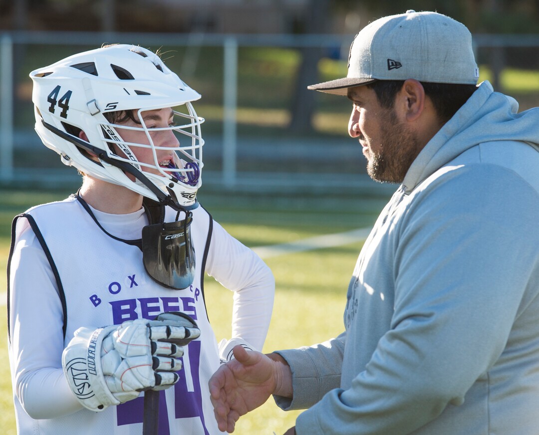 (Rick Egan | The Salt Lake Tribune) Player Seth Linvulle gets instructions from Box Elder lacrosse coach Juan Gaytan during a tournament in Logan on Saturday, Nov. 3, 2018.