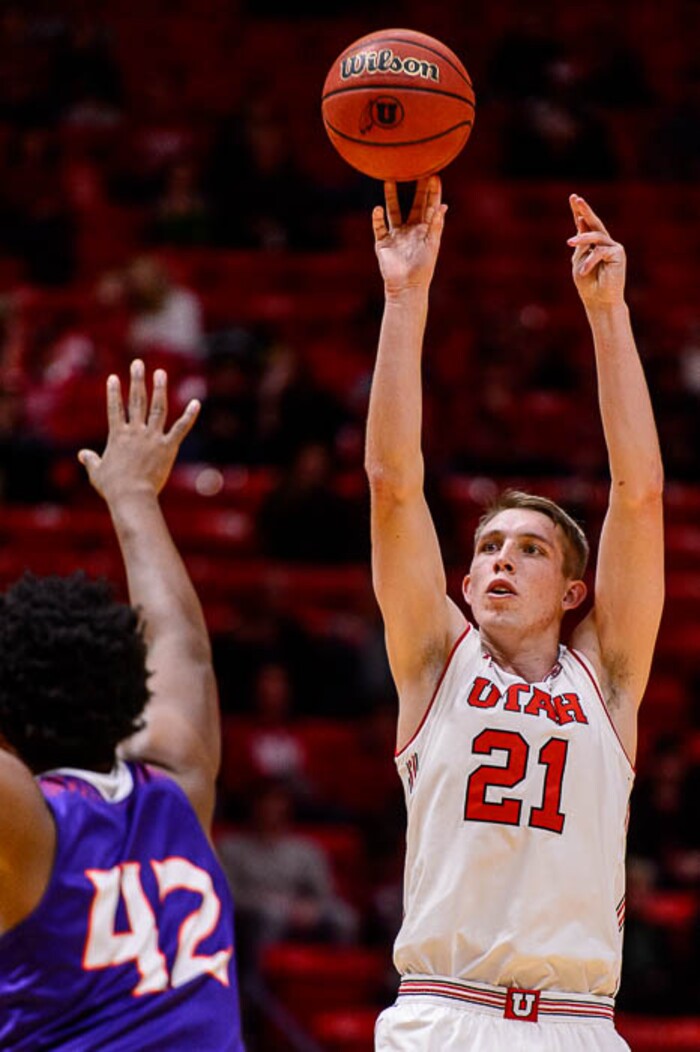 (Trent Nelson | The Salt Lake Tribune)  Utah Utes forward Tyler Rawson (21) shoots over Northwestern State Demons center Larry Owens (42) as the University of Utah hosts Northwestern State, NCAA basketball in Salt Lake City, Wednesday December 20, 2017.