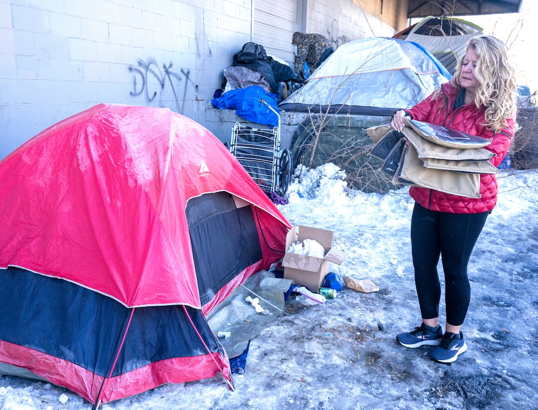 (Rick Egan | The Salt Lake Tribune) Carin Crowe from Habitat for Humanity and members of Black Lives for Humanity distribute wool blankets that were donated by the Sikh community to help the unsheltered stay warm on Thursday, Dec. 23, 2021.