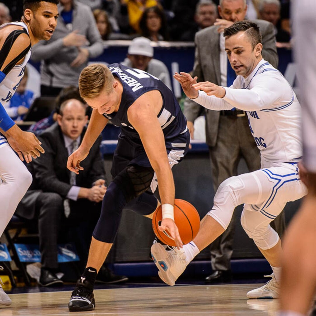 (Trent Nelson | The Salt Lake Tribune)  Brigham Young Cougars guard Nick Emery (4) forces a turnover by Utah State Aggies guard Sam Merrill (5) as BYU hosts Utah State, NCAA basketball in Provo on Wednesday Dec. 5, 2018.