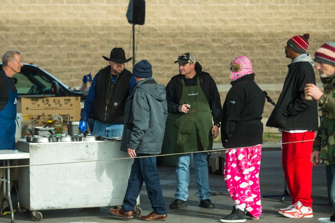 (Chris Detrick  |  The Salt Lake Tribune)  Eagles Ranch Ministries chaplain Eric Burson serves Thanksgiving Day meals during the Eagle Ranch Chuckwagon under the viaduct at 500 South and 600 West in Salt Lake City Thursday, November 23, 2017.  