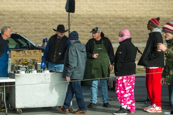(Chris Detrick | The Salt Lake Tribune) Eagles Ranch Ministries chaplain Eric Burson serves Thanksgiving Day meals during the Eagle Ranch Chuckwagon under the viaduct at 500 South and 600 West in Salt Lake City Thursday, November 23, 2017.