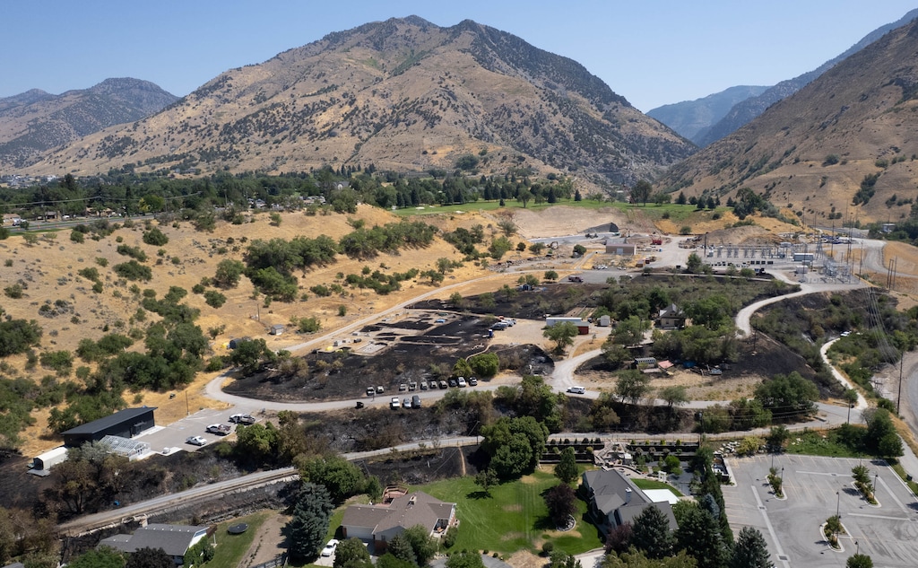 (Francisco Kjolseth | The Salt Lake Tribune) Crews put out hotspots at the Canyon Road Fire in Logan. On Friday, city officials discussed why some didn't get evacuation notices.