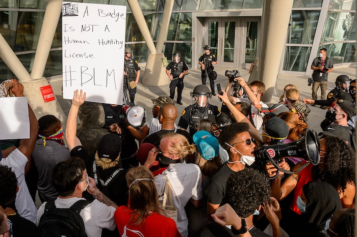 (Trent Nelson  |  The Salt Lake Tribune) Protesters in front of the Public Safety Building during a protest against police brutality in Salt Lake City on Monday, June 1, 2020.