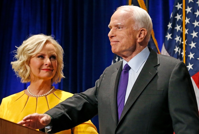 FILE - In this Nov. 8, 2016 file photo, Sen. John McCain, R-Ariz., accompanied by his wife Cindy McCain, pauses after speaking in Phoenix. A Trump administration official says that Cindy McCain is likely to take on a prominent State Department role. (AP Photo/Ross D. Franklin, File)