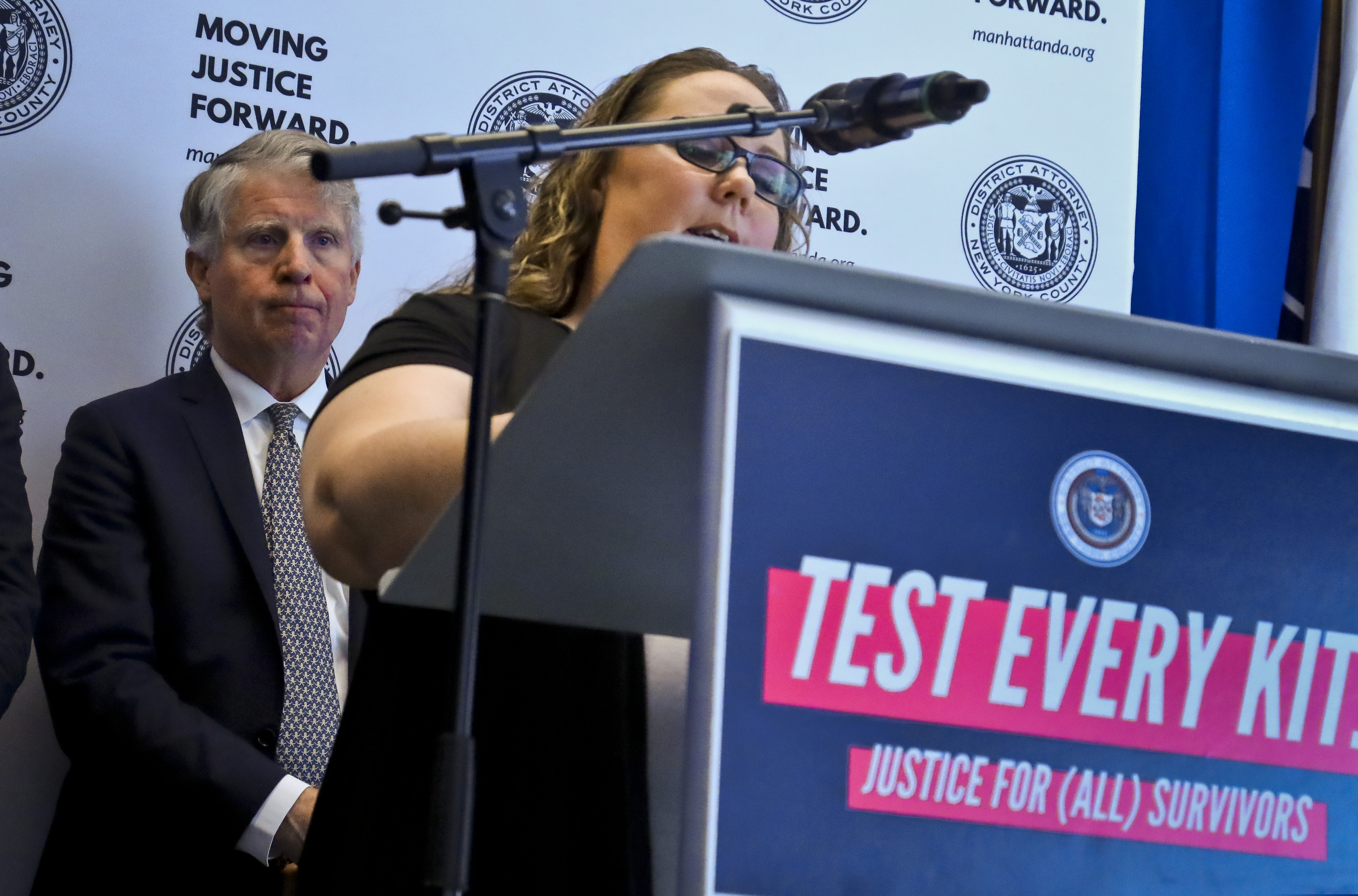 (AP Photo/Bebeto Matthews) Manhattan District Attorney Cyrus Vance, left, listens while sexual assault survivor Tracy Rios speaks about her attack, during a press conference, Tuesday March 12, 2019, in New York. Vance released results of a $38 million national initiative to help law enforcement agencies perform DNA tests on evidence in thousands of languishing rape cases.