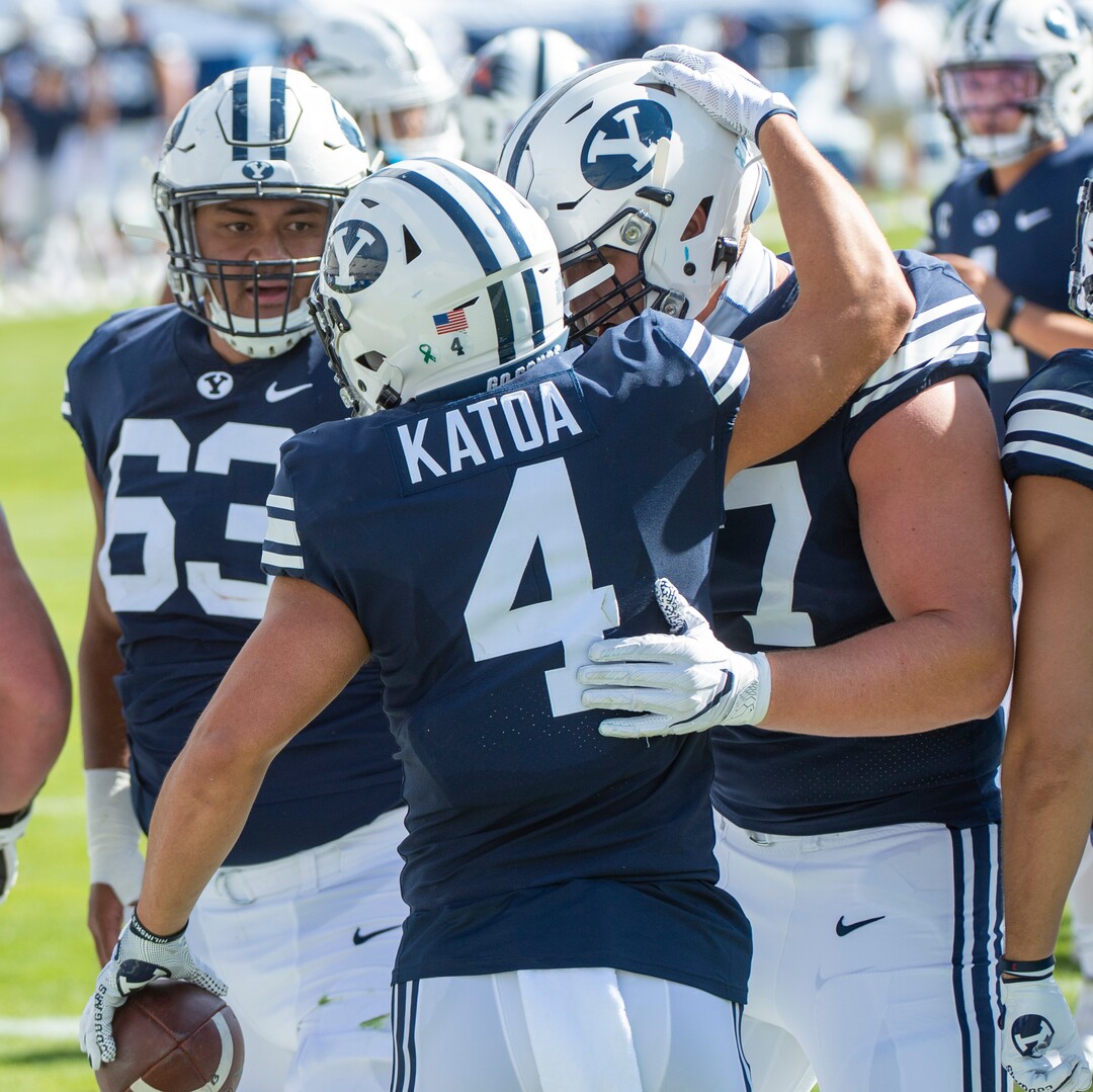 (Rick Egan  |  The Salt Lake Tribune)    Team mates congratulate Brigham Young running back Lopini Katoa (4) after scoring a Cougar touchdown, in football action between the Brigham Young Cougars and the UTSA Roadrunners, at Lavell Edwards stadium, Saturday, Oct. 10, 2020.