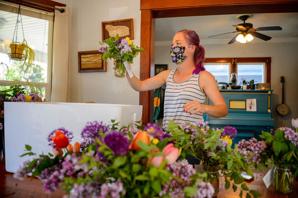 (Trent Nelson  |  The Salt Lake Tribune) Anna Zack, co-founder of Zack Family Farms, organizing Mother's Day deliveries at her home in Ogden on Saturday, May 9, 2020. Anna and Ben Zack started Zack Family Farms last fall with hopes of selling flowers to florists for weddings. But during COVID-19, they had to adapt and are now making home deliveries with their flowers.