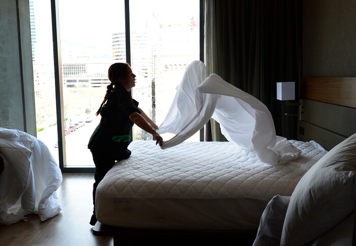(Scott Sommerdorf | The Salt Lake Tribune)
Leticia Longoria changes a corner room's linen at the new AC Hotel in downtown Salt Lake City, Friday, April 20, 2018. Hotels and other lodging properties had 11 percent more employees last month than in the previous March, helping to lead Utah to a 3.3 percent year-over-year job growth rate, the best in the nation.
