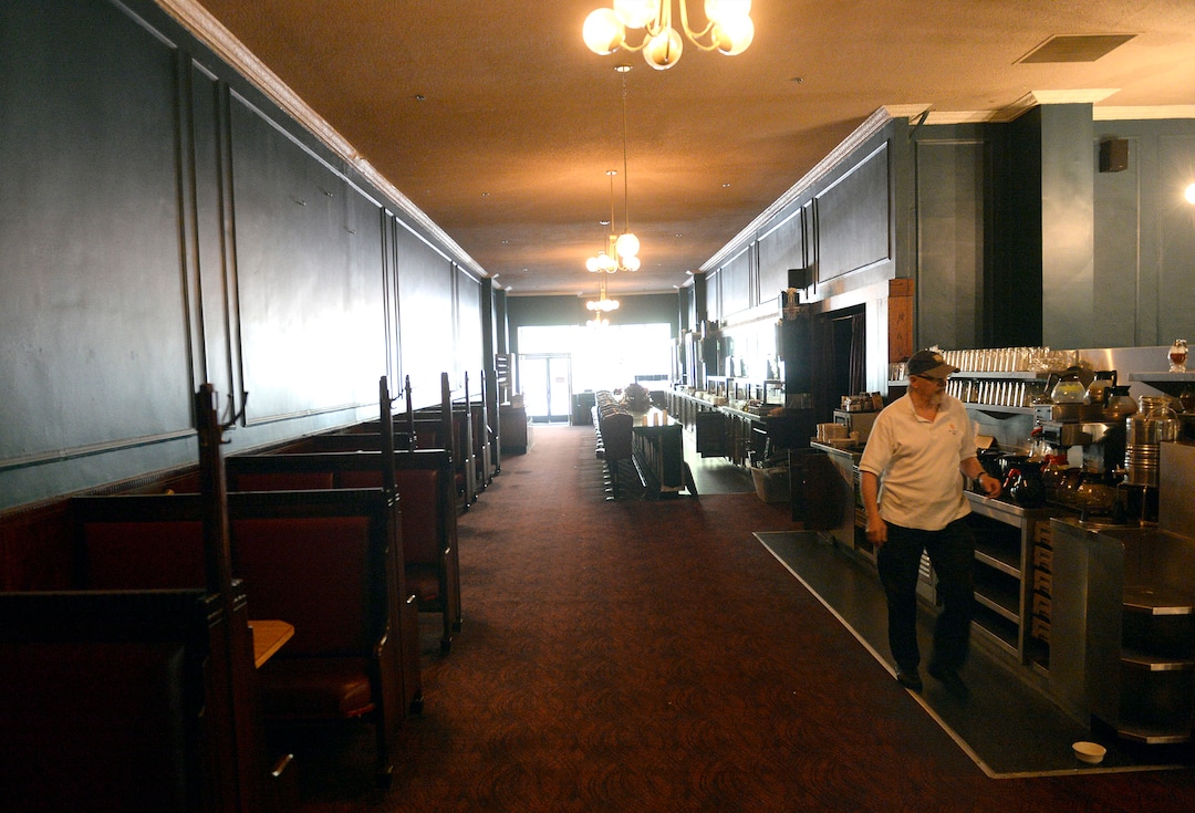 Al Hartmann  |  The Salt LakeTribune
John Speros walks through the empty dining room at Lamb's Grill in Salt Lake City. The restaurant closed in the summer of 2017, after nearly 100 years in business.