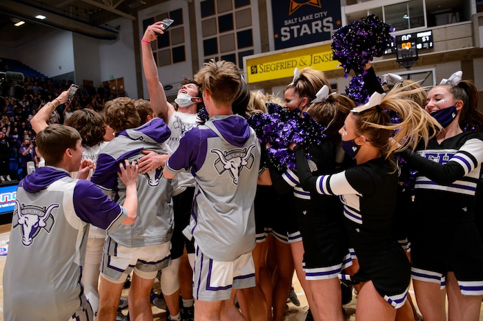 (Trent Nelson | The Salt Lake Tribune) Lehi players celebrate a win over Farmington High School in the 5A boys basketball state championship game, in Taylorsville on Saturday, March 6, 2021.
