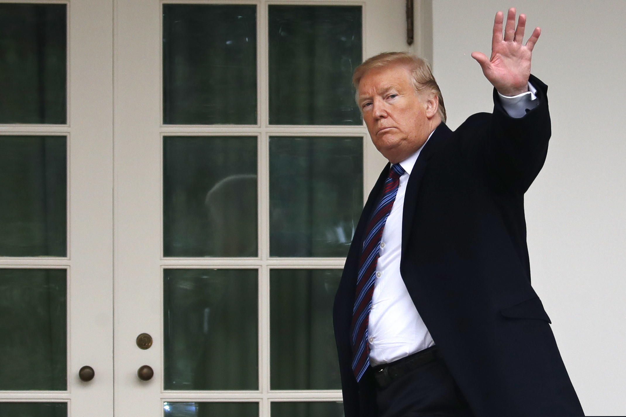 (Jacquelyn Martin | The Associated Press) President Donald Trump waves as he leaves the Rose Garden of the White House after speaking and taking questions from the media after his meeting with Congressional leaders on border security, Friday, Jan. 4, 2019, at the White House in Washington.