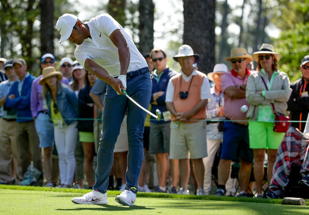 (AP Photo/Chris Carlson) Tony Finau hits a shot on the fourth hole during the second round at the Masters golf tournament Friday, April 6, 2018, in Augusta, Ga.