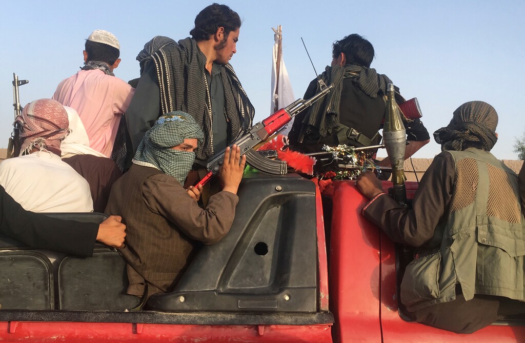 Taliban fighters ride in their vehicle in Surkhroad district of Nangarhar province, east of Kabul, Afghanistan, Saturday, June 16, 2018. A suicide bomber blew himself up in eastern Afghanistan on Saturday as mostly Taliban fighters gathered to celebrate a three-day cease fire marking the Islamic holiday of Eid al-Fitr, killing 21 people and wounding another 41, said the Nangarhar provincial Police Chief Ghulam Sanayee Stanikzai. Most of the dead and wounded were believed to be Taliban, he said. (AP Photo/Rahmat Gal)