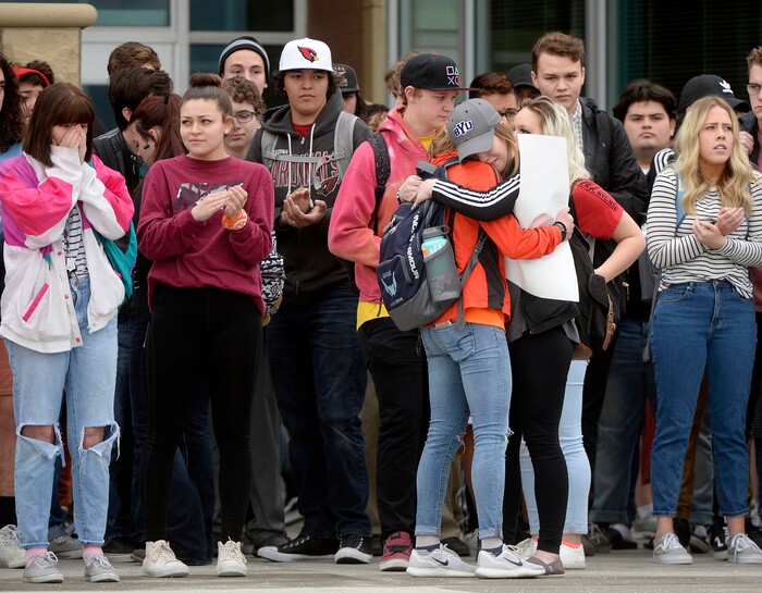 (Al Hartmann  |  The Salt Lake Tribune) 	
About 80 students at Westlake High School in Saratoga Springs left class and stood together in silence at the front entrance of the school Wednesday March 14, 2018 to remember the 17 students who died in a school shooting in Florida.  They held posters of the names of those killed. 