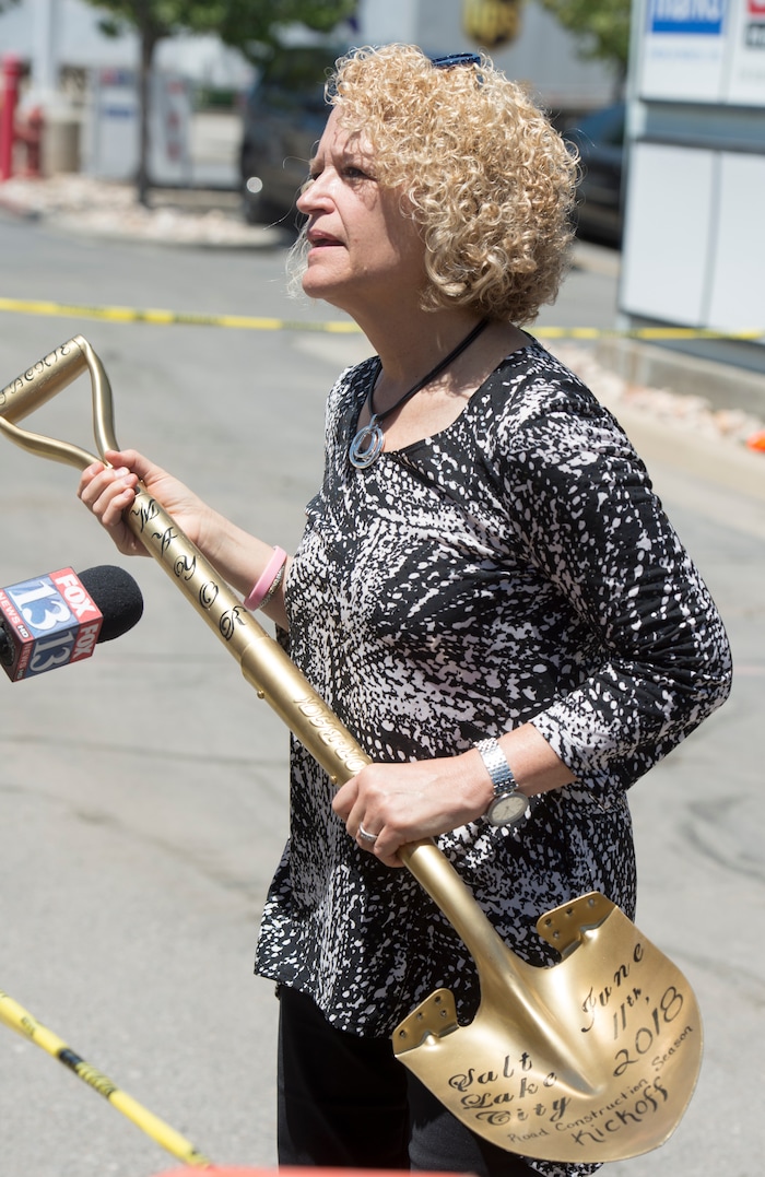 (Rick Egan | The Salt Lake Tribune) Salt Lake City Mayor Jackie Biskupski holds a golden shovel, as she talks to the news media, after announcing the start of the city’s 2018 road construction season at a new conference at 720 South Gladiola Street. A total of ten projects are scheduled for completion by the City’s Engineering Division through a combined investment of $5 million. Monday, June 11, 2018.