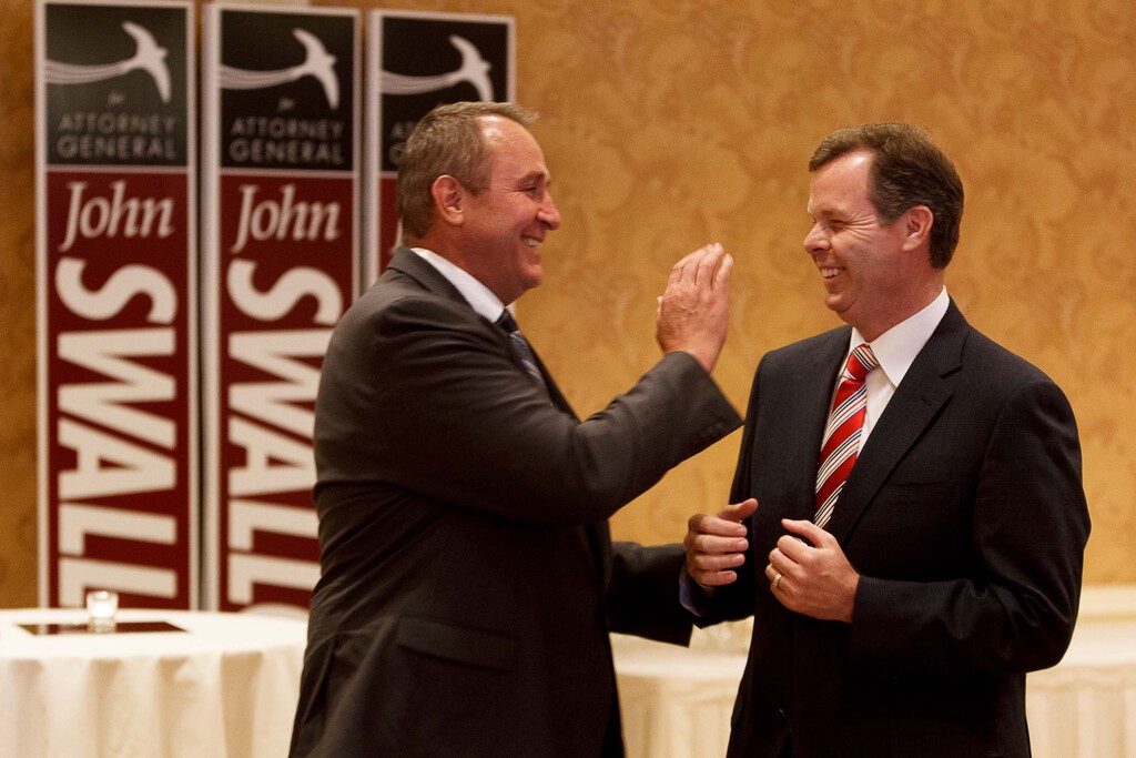 (Trent Nelson  |  Tribune file photo)

Utah Attorney General Mark Shurtleff, left, and Utah Attorney General candidate John Swallow share a laugh on the night Swallow secured the Republican nomination to run for the Attorney General's office.