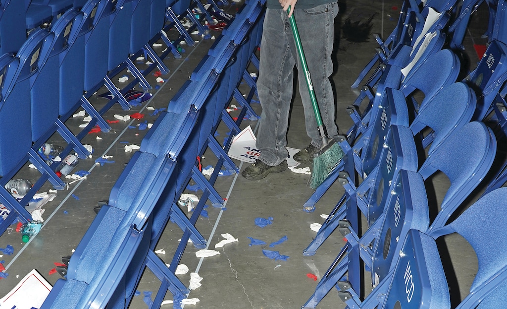 A worker sweeps the floor of the Fiserv Forum in Milwaukee, Wis., at the end of the Republican National Convention, July 18, 2024. (Jamie Lee Taete/The New York Times)