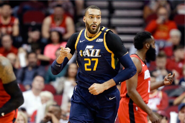 Utah Jazz center Rudy Gobert (27) reacts after scoring a basket during the first half of an NBA basketball game against the Houston Rockets, Sunday, Feb. 9, 2020, in Houston. (AP Photo/Eric Christian Smith)
