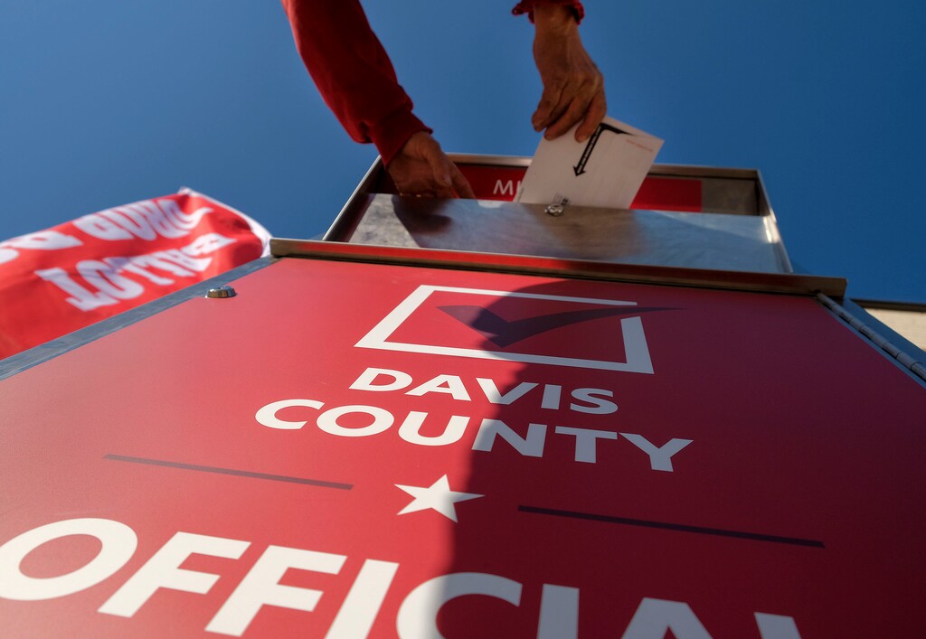 (Leah Hogsten  |  The Salt Lake Tribune) Voters in Davis County drop off their ballots at the Davis County Library's South Davis Branch in Bountiful, Nov. 3, 2020. 