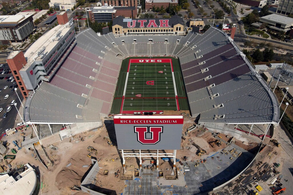 (AP Photo/Julio Cortez. File) This Oct. 4, 2020 file drone photo, shows an aerial view of the University of Utah's  Rice-Eccles Stadium in Salt Lake City. The season opener scheduled for Saturday between Utah and Arizona in Salt Lake City was canceled following a request from the Utes due to what the Pac-12 said were a number of COVID-19 cases among Utah players.