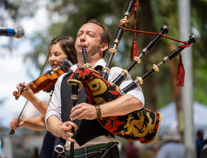 (Rick Egan | The Salt Lake Tribune) , Rebecca Lomnicky plays fiddle and 
David Brewer plays the bagpipes with the The Fire, at the Payson Scottish Festival, on Saturday, July 9, 2022.
