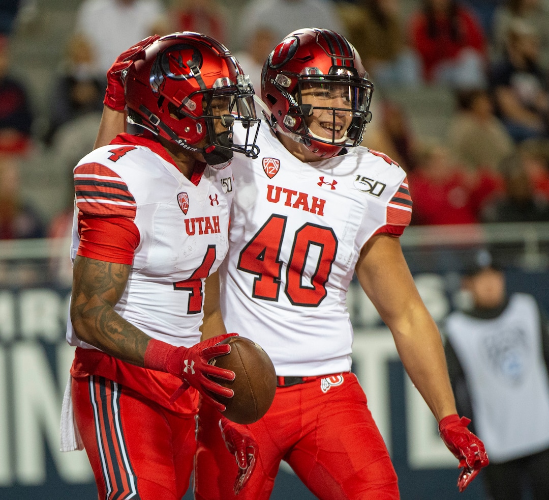 (Rick Egan  |  The Salt Lake Tribune)      Utah Utes tight end Ali'i Niumatalolo (40) congratulates Utah Utes running back TJ Green (4) after he scored a touchdown, in PAC-12 action between the Utah Utes and the Arizona Wildcats in Tucson, Saturday, Nov. 23, 2019.