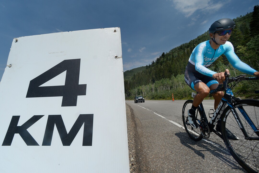 (Scott Sommerdorf   |  The Salt Lake Tribune)   A rider passes the 4 KM to go mark during Stage 3 of the Tour of Utah in Big Cottonwood Canyon, August 2, 2017.  