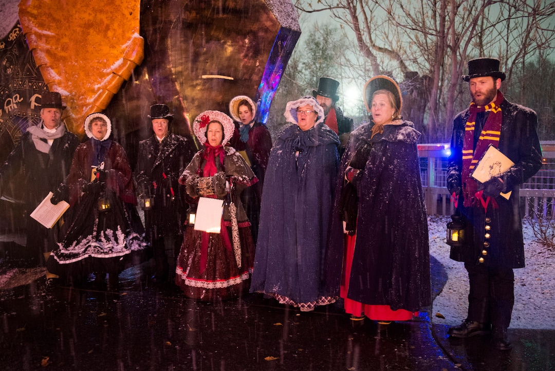 (Rick Egan  |  The Salt Lake Tribune)   A group of carolers sing as the ZooLights at Hogle Zoo are turned on, Friday, Nov. 30, 2018. The lights continue  through December 31st, 