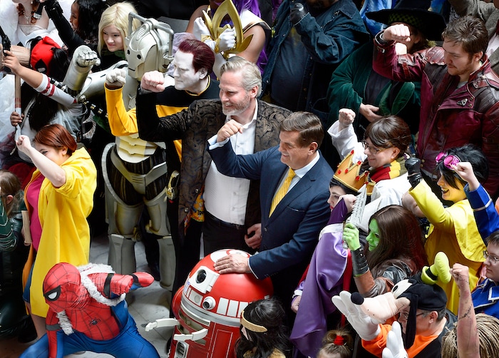 (Scott Sommerdorf | The Salt Lake Tribune) FanX Salt Lake Comic Convention co-founders Dan Farr, center left, and Bryan Brandenburg next to him, pose for a photo Wednesday with fans in the Utah Capitol Rotunda.