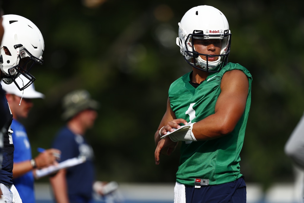 (Photo courtesy of Jaren Wilkey, BYU photo) BYU quarterback Jaren Hall, checks a play call in a non-contact scrimmage on Aug. 2, 2018. Hall is one of three QBs trying to become Zach Wilson's backup and will also play baseball for the Cougars this spring.