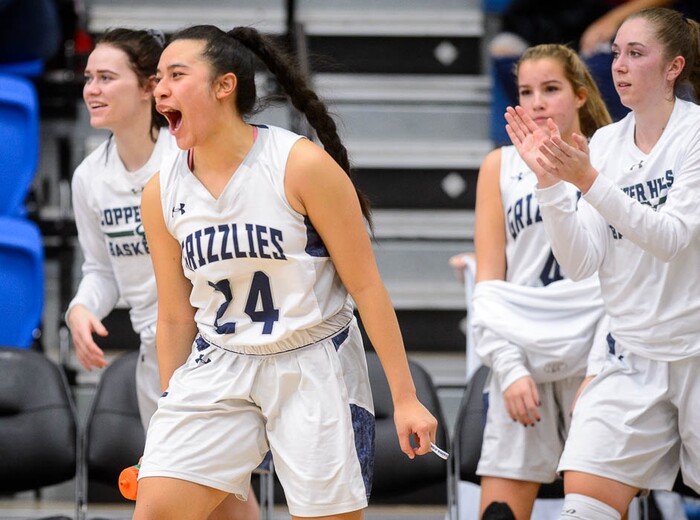 (Trent Nelson | The Salt Lake Tribune)  Copper Hills's Laci Olsen (24) and other players celebrate after the final buzzer as Layton faces Copper Hills in the 6A High School Girls' Basketball Tournament at SLCC in Taylorsville, Thursday Feb. 22, 2018.