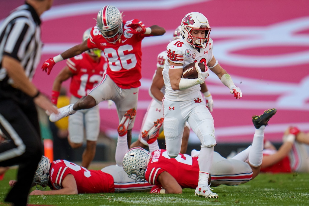 (Trent Nelson  |  The Salt Lake Tribune) Utah Utes wide receiver Britain Covey (18) runs a kick return for a touchdown against the Ohio State Buckeyes at the Rose Bowl in Pasadena, Calif., on Saturday, Jan. 1, 2022.