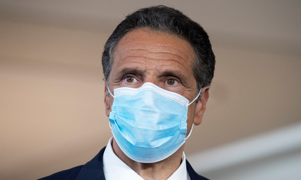(Mark Lennihan | AP) Gov. Andrew Cuomo wears a mask during a news conference at Laguardia Airport's Terminal B, Wednesday, June 10, 2020 in New York.