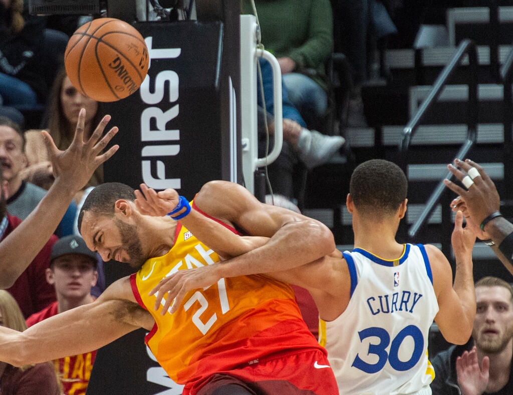 (Rick Egan  |  The Salt Lake Tribune)   Utah Jazz center Rudy Gobert (27) gets tangled up with Golden State Warriors guard Stephen Curry (30), in NBA action between Utah Jazz and Golden State Warriors, in Salt Lake City, Wednesday, Dec. 19, 2018.