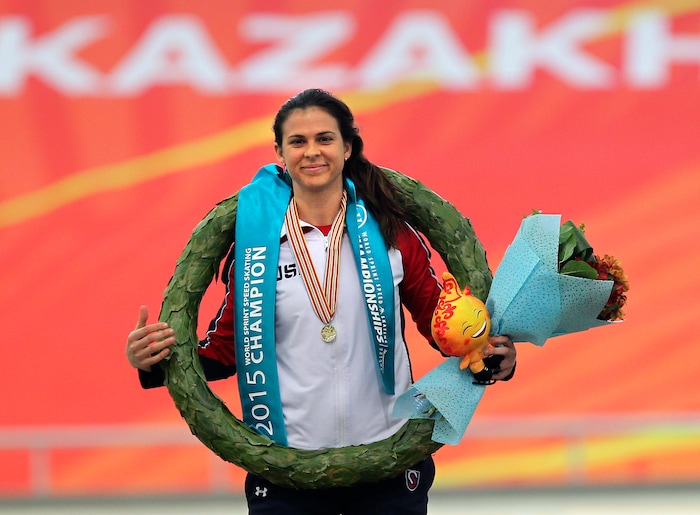 Brittany Bowe of the U.S. attends an awarding ceremony after the World Speed Skating Sprint Championship in Astana, Kazakhstan, Sunday, March 1, 2015. Brittany Bowe took first place. (AP Photo/Alexei Filippov)
