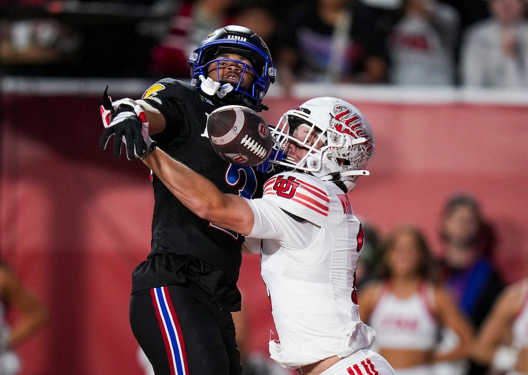 (Bethany Baker  |  The Salt Lake Tribune) Kansas Jayhawks cornerback Syeed Gibbs (2) interferes as Utah Utes wide receiver Creed Whittemore (2) goes to catch the ball during the game between the Utah Utes and the Kansas Jayhawks at Rice-Eccles Stadium in Salt Lake City on Saturday, Oct. 10, 2026.