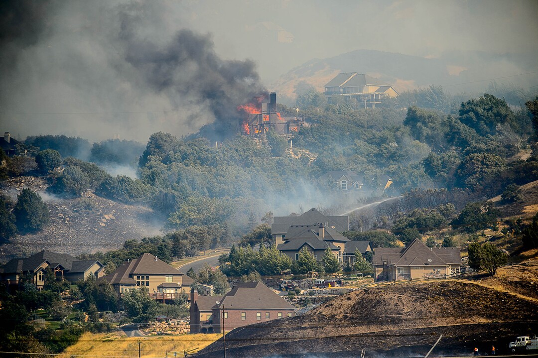 (Trent Nelson | The Salt Lake Tribune)  A home burns in at the mouth of Weber Canyon, Tuesday September 5, 2017.