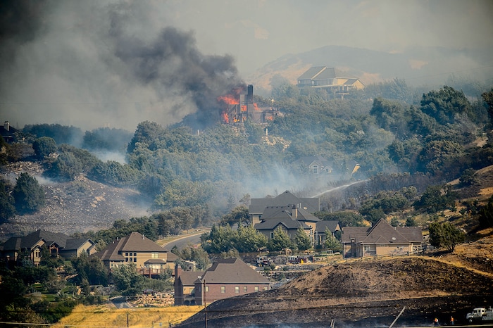 (Trent Nelson | The Salt Lake Tribune)  A home burns in at the mouth of Weber Canyon, Tuesday September 5, 2017.