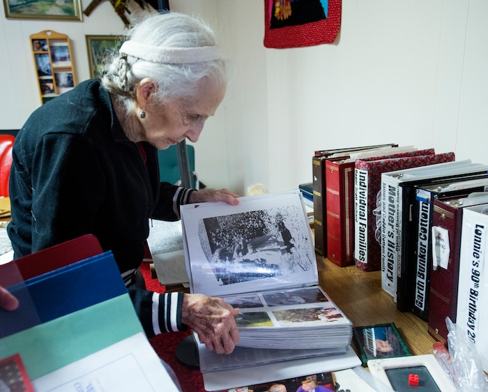 (Rick Egan  |  The Salt Lake Tribune) Carol Moseley looks through photo albums in her basement at her home in Holladay, Friday, October 6, 2017. Her husband, World War II veteran Lonnie Moseley, crash landed in France, avoiding detection of the Germans by hiding out with a French farming family.