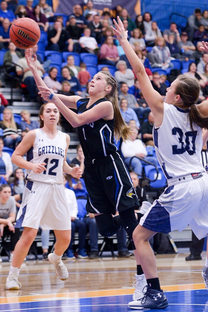(Leah Hogsten  |  The Salt Lake Tribune)  Pleasant Grove's Kenna Sparks for two.   Copper Hills High School girls' basketball team defeated Pleasant Grove High School 66-25 during their Class 6A girls' basketball playoff opener at Salt Lake Community College Tuesday, Feb. 20, 2018. 