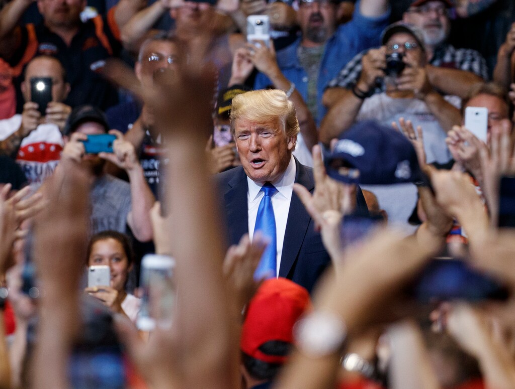 (AP Photo | Carolyn Kaster) IN this Aug. 2, 2018, photo, President Donald Trump is cheered as he arrives for a rally at Mohegan Sun Arena at Casey Plaza in Wilkes Barre, Pa..