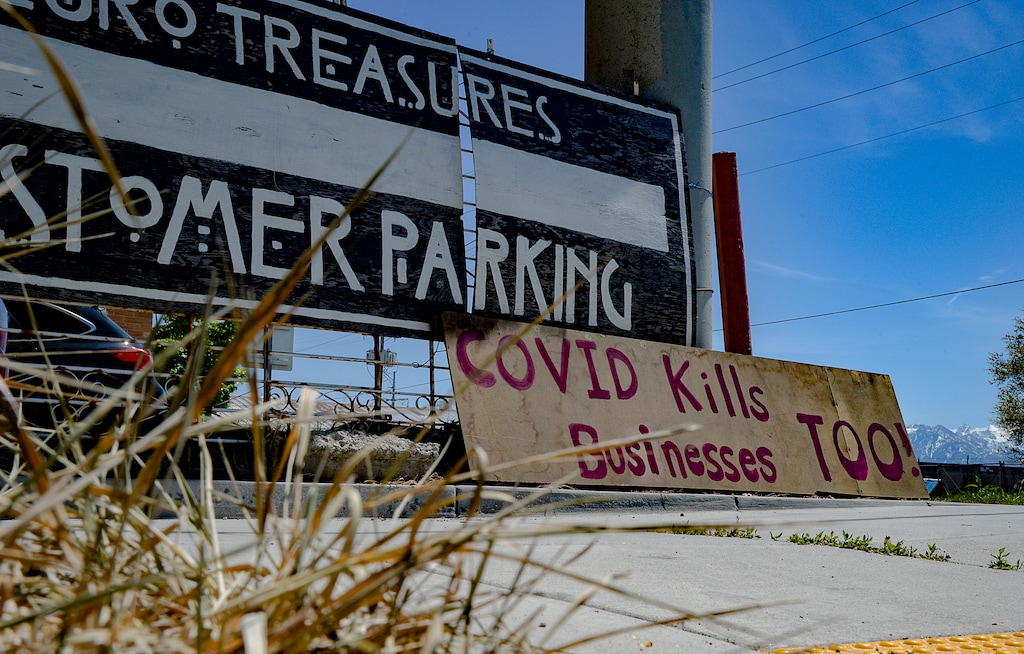 (Francisco Kjolseth  |  The Salt Lake Tribune) Euro Treasures Antiques places "we give up, store closing," signs in downtown Salt Lake City as the COVID-19 pandemic takes its toll on businesses on Wednesday, April 29, 2020.