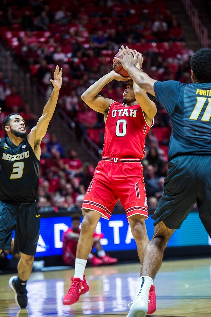 (Chris Detrick  |  The Salt Lake Tribune)  Utah Utes guard Sedrick Barefield (0) shoots past Missouri Tigers guard Kassius Robertson (3) and Missouri Tigers forward Jontay Porter (11) during the game at the Jon M. Huntsman Center Thursday, November 16, 2017.   